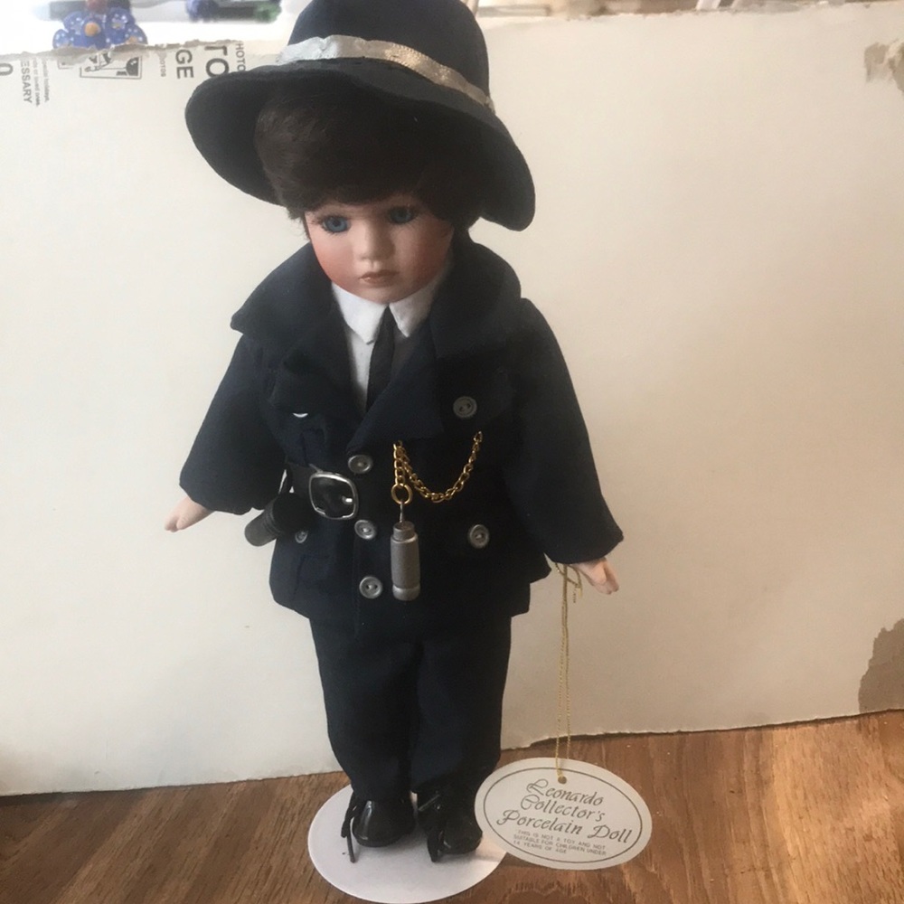 New !!   Leonardo Collectors Porcelian doll.  his name is Policeman , a rare